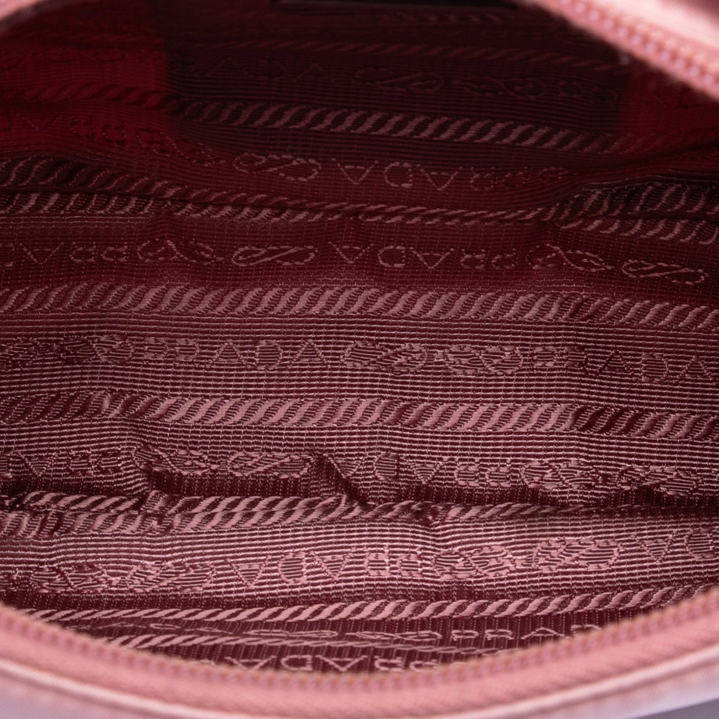 Prada Re-Edition 2000 pink nylon mini bag interior view